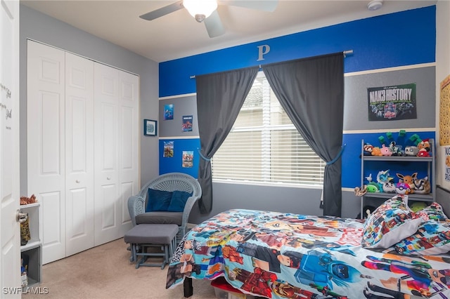 bedroom with a closet, ceiling fan, and carpet