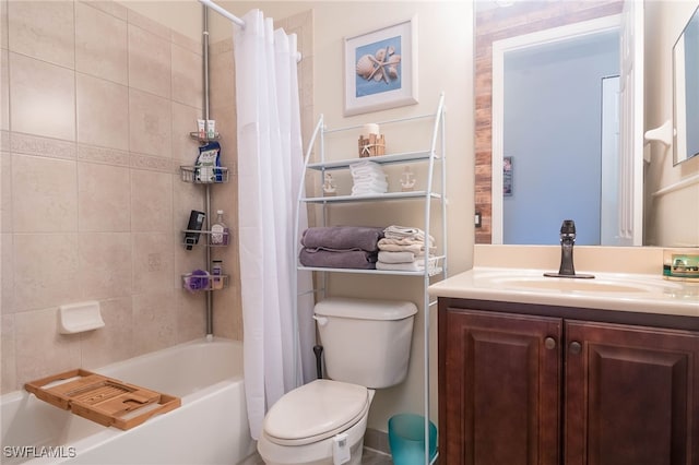 full bathroom with vanity, shower / tub combo, and toilet