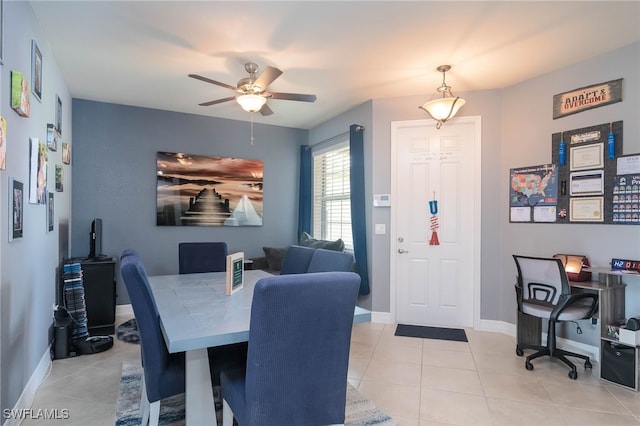 dining space featuring light tile patterned flooring and ceiling fan