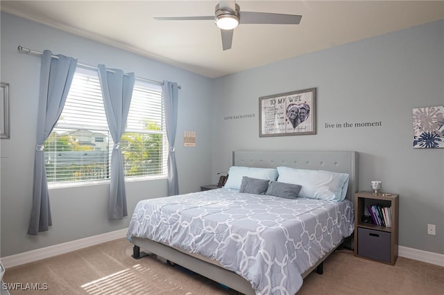 bedroom with ceiling fan and carpet