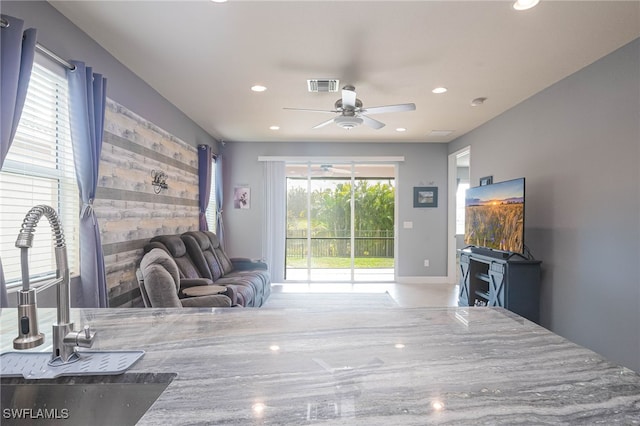 living room with ceiling fan