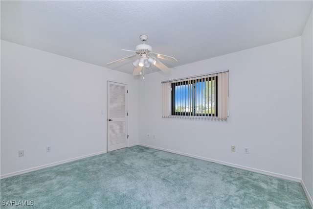 empty room with light carpet and ceiling fan