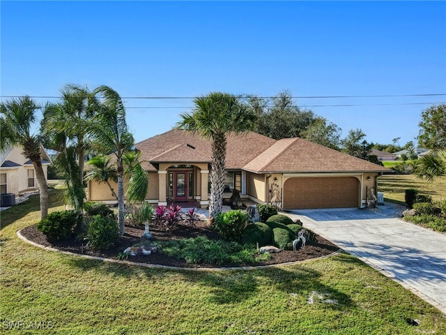 view of front of house featuring cooling unit, a front lawn, and a garage