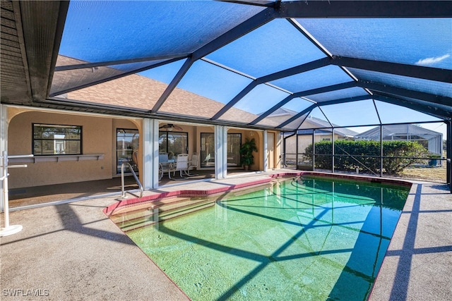 view of pool with a lanai and a patio area