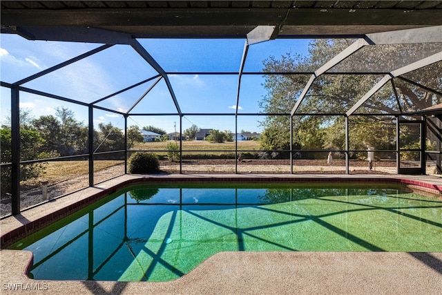 view of pool featuring a lanai