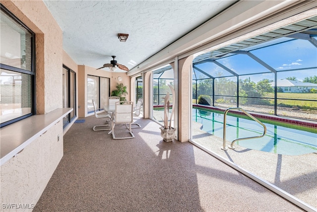 view of pool with ceiling fan