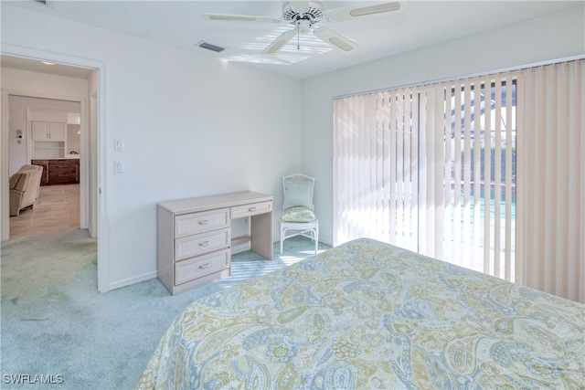 bedroom with ceiling fan and light carpet