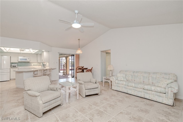 tiled living room with ceiling fan and vaulted ceiling