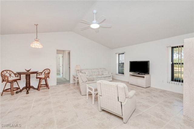 living room featuring ceiling fan and lofted ceiling