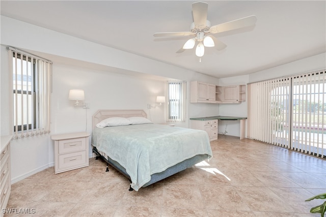 bedroom featuring ceiling fan, access to outside, and multiple windows