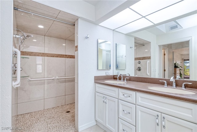 bathroom featuring vanity and a tile shower