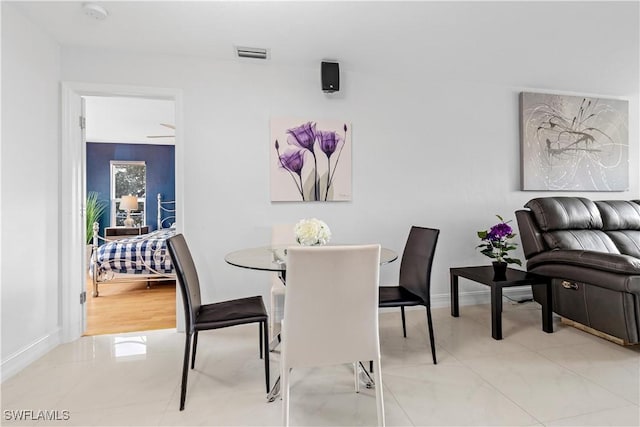 dining space with light tile patterned flooring