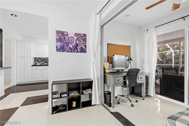 tiled office space featuring ceiling fan