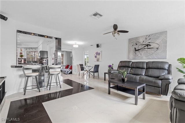 living room featuring ceiling fan