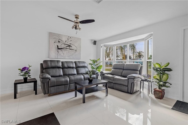 living room with tile patterned floors and ceiling fan