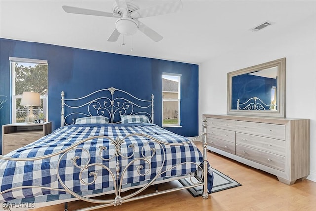 bedroom featuring hardwood / wood-style flooring and ceiling fan