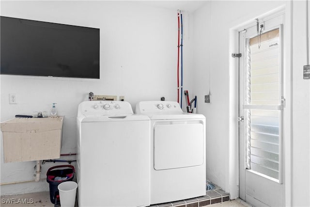 washroom featuring sink and independent washer and dryer