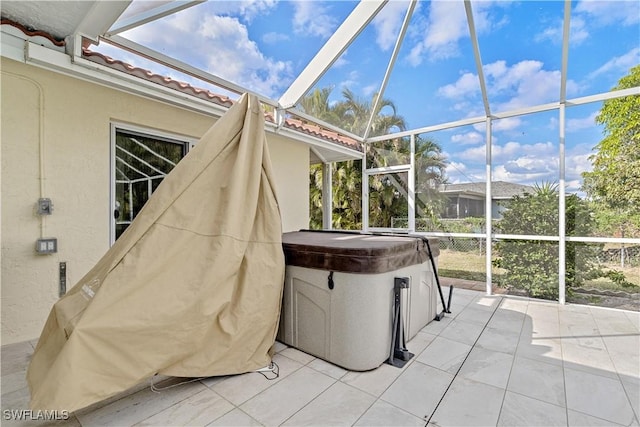 unfurnished sunroom featuring a jacuzzi