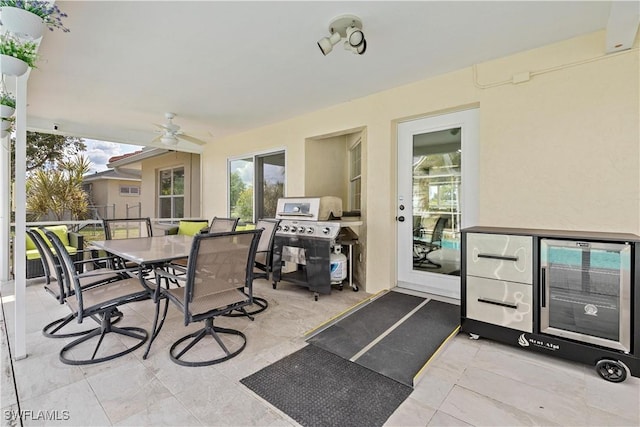 view of patio with grilling area and ceiling fan