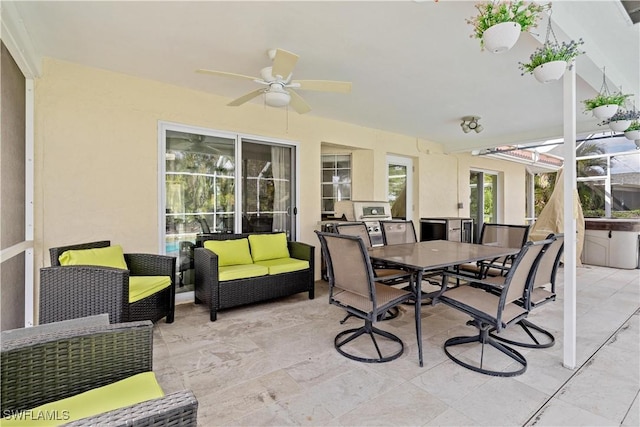 sunroom / solarium featuring ceiling fan