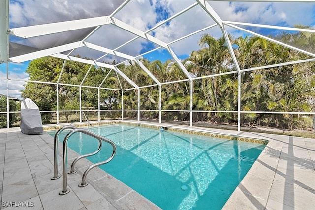 view of pool featuring a lanai and a patio area