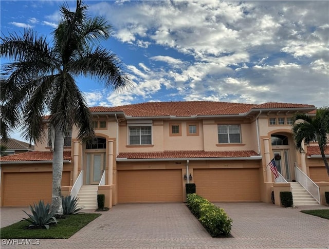 mediterranean / spanish house with a garage