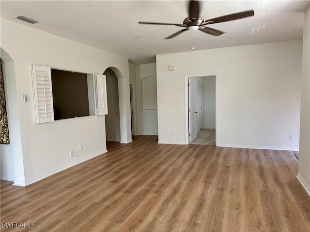 spare room featuring light hardwood / wood-style floors and ceiling fan