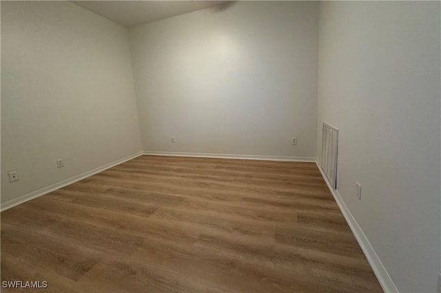 empty room featuring hardwood / wood-style flooring