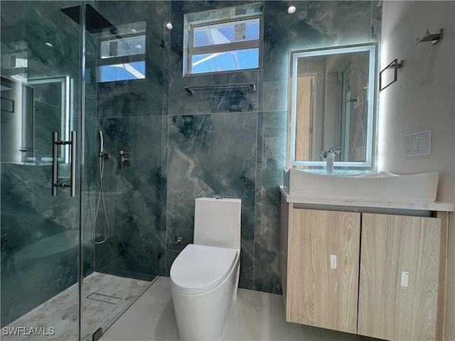 bathroom with vanity, a shower with shower door, and toilet