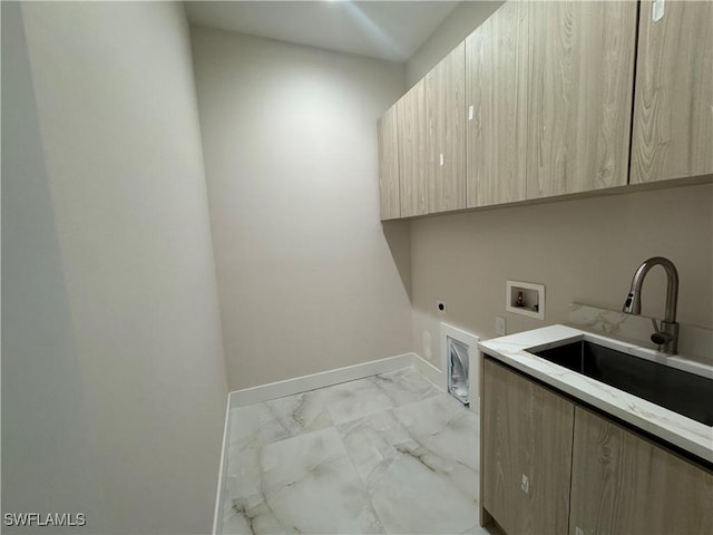 clothes washing area featuring cabinet space, hookup for a washing machine, marble finish floor, electric dryer hookup, and a sink