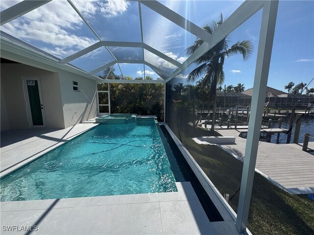 view of swimming pool featuring an in ground hot tub, a patio, a boat dock, and glass enclosure