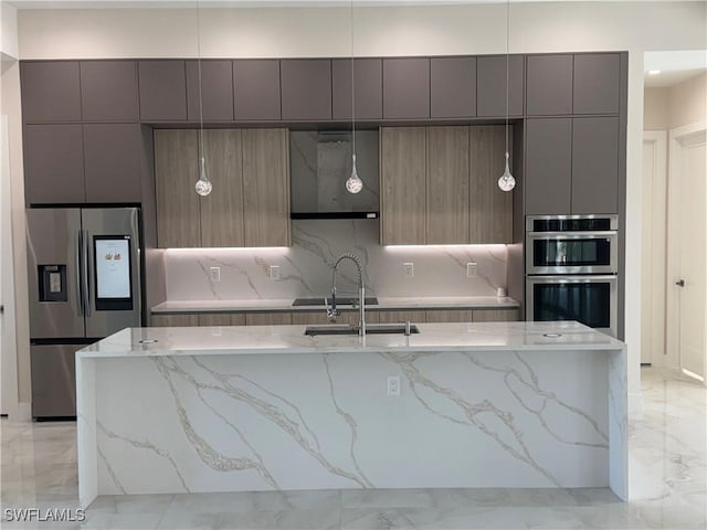 kitchen featuring marble finish floor, stainless steel appliances, modern cabinets, and a sink