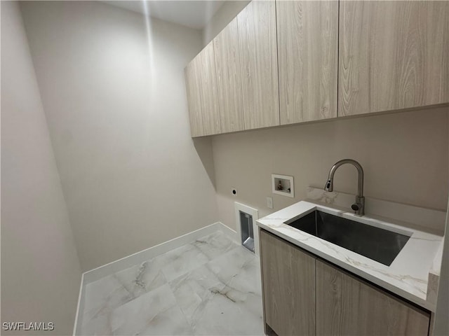 laundry area with washer hookup, marble finish floor, cabinet space, hookup for an electric dryer, and a sink