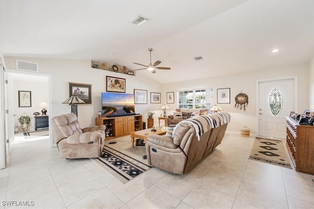 living room with light tile patterned floors, ceiling fan, and lofted ceiling