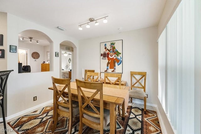 dining space featuring ceiling fan