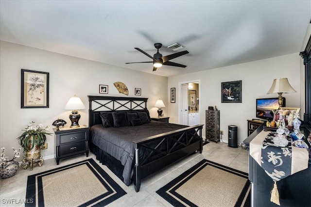 tiled bedroom featuring connected bathroom and ceiling fan