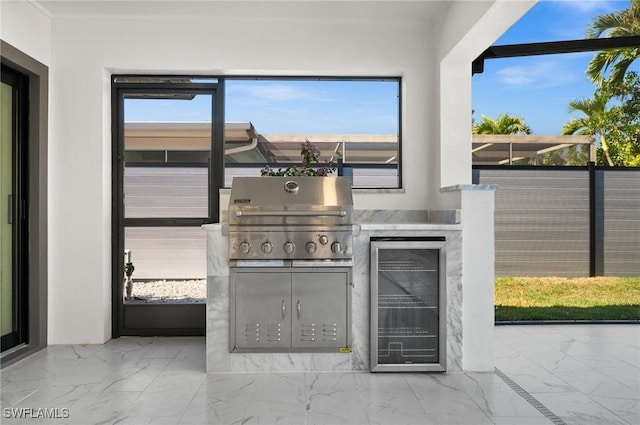 view of patio featuring wine cooler, area for grilling, and grilling area