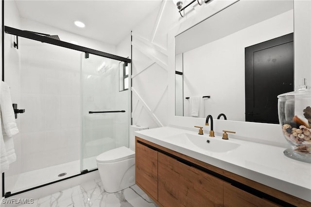 bathroom featuring vanity, toilet, and a shower with shower door