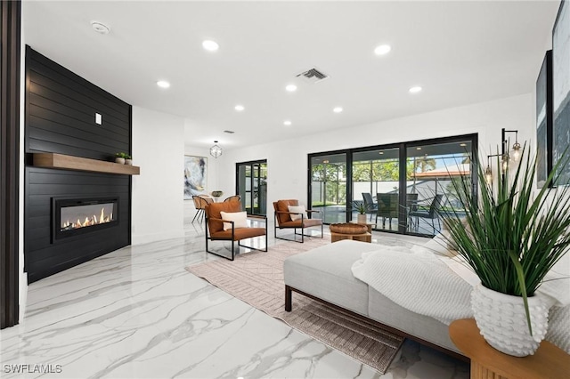 living room with a large fireplace