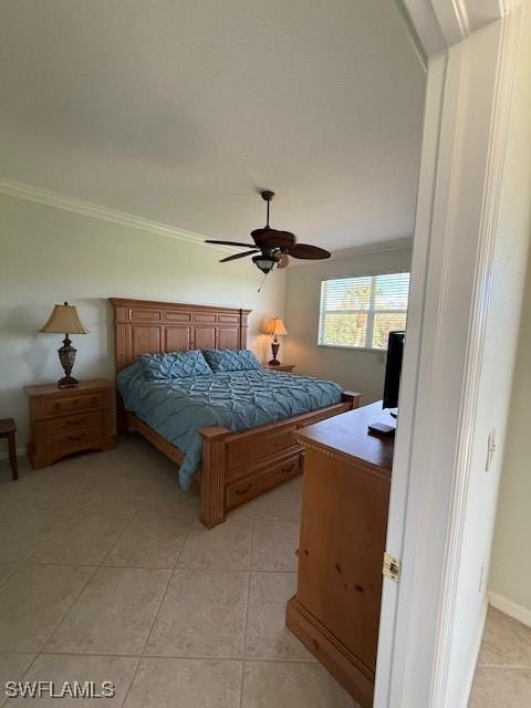 bedroom featuring ceiling fan, light tile patterned flooring, and ornamental molding