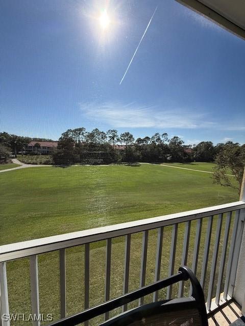 view of yard with a balcony