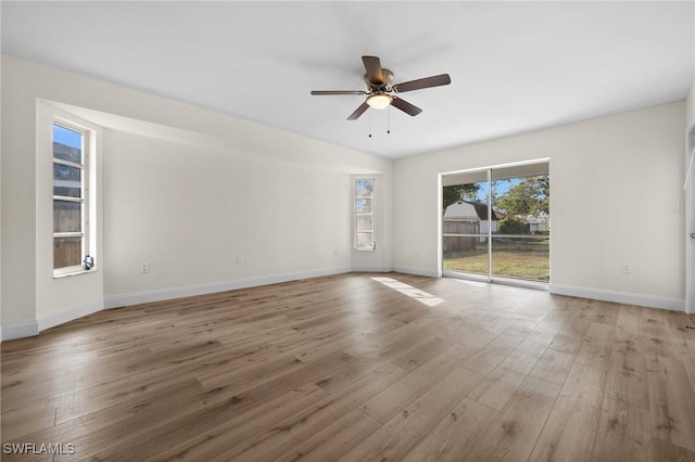 empty room featuring ceiling fan and light hardwood / wood-style floors