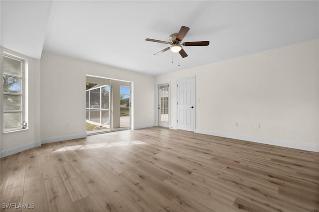 empty room featuring ceiling fan and light wood-type flooring