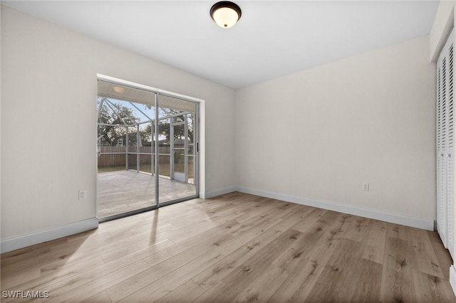 spare room with light wood-type flooring