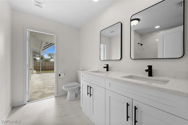 bathroom with vanity and toilet