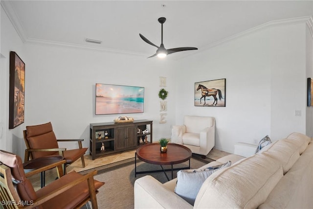 living room with ceiling fan, crown molding, and light tile patterned flooring