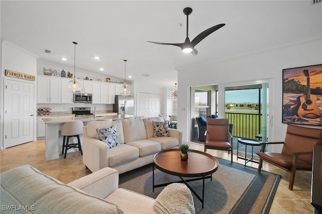 living room with ceiling fan, lofted ceiling, crown molding, and light tile patterned floors