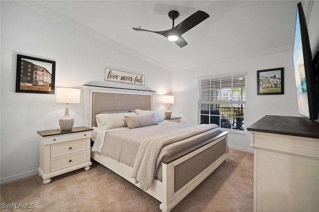 carpeted bedroom with ceiling fan and crown molding