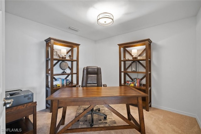 office area featuring light colored carpet