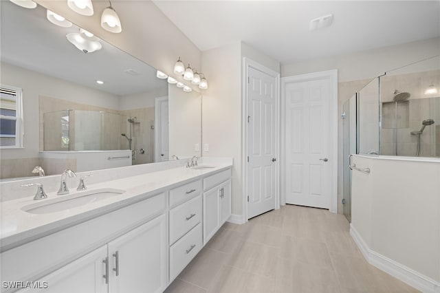 bathroom featuring tile patterned flooring, vanity, and an enclosed shower